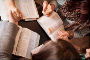 group of women reading the bible together
