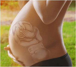 pregnant woman with an illustration of a baby inside of her belly