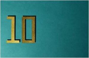 gold number ten against a teal background