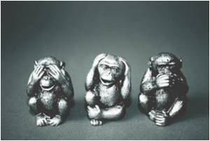 three silver monkey statues