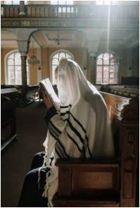 person reading the bible in a church